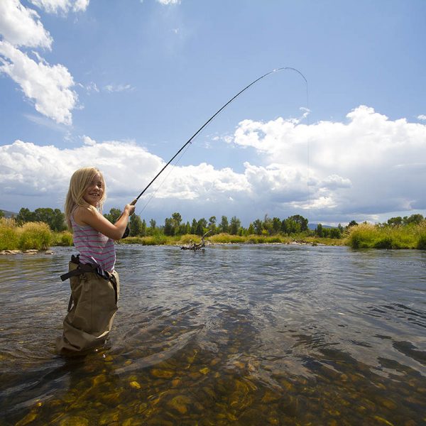 Girl Fly Fishing The Provo River Utah with the foremost Utah fly fishing guide service