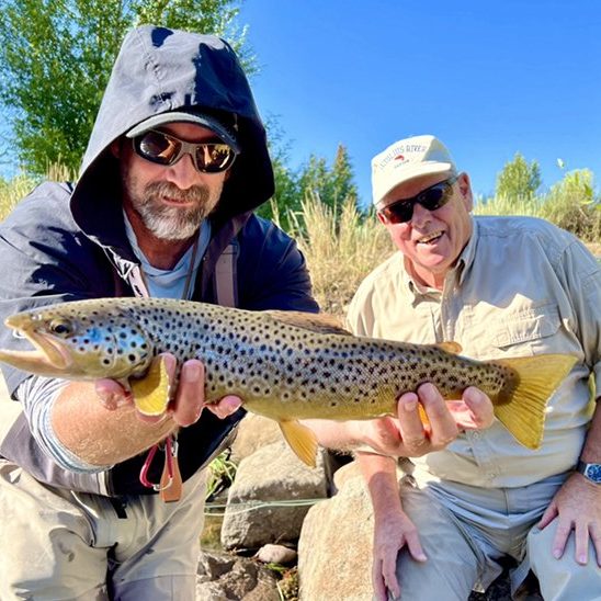 Jeremy Allan and a happy client with a great Provo River brown trout.