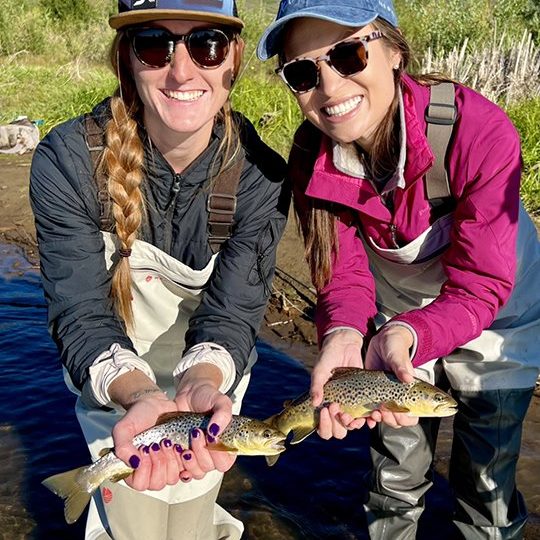 Two ladies with Provo River brown trout.