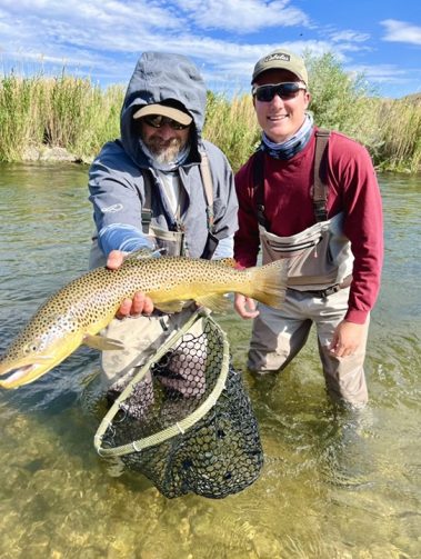 Guide Jeremy Allan with a happy client from one of our small stream guided fly fishing trips.