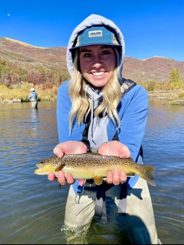 A happy girl with a nice brown trout on a beauty of a Fall day.