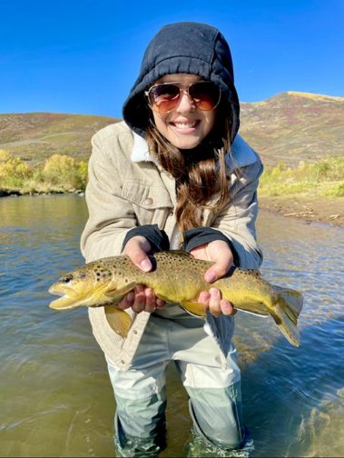 A happy lady with a nice Provo River brown trout on a beautiful Fall day.
