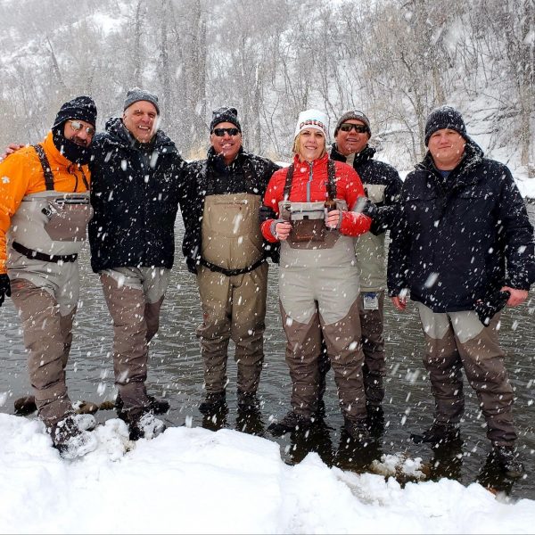 Group of happy fly fisherman in the snow