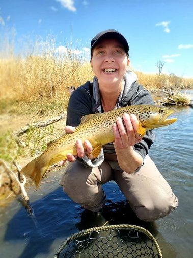 A Jeremy Allan Fly Fishing customer with a big brown trout