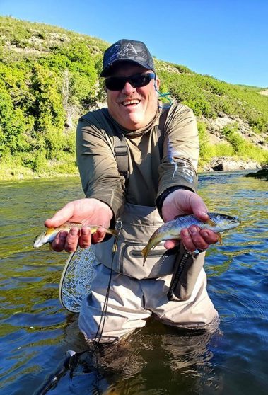 A Jeremy Allan Fly Fishing customer with a big brown trout on the Provo River