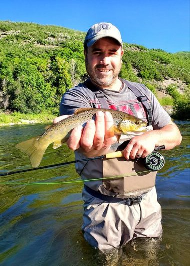 A Jeremy Allan Fly Fishing customer with a big brown trout on the Provo River