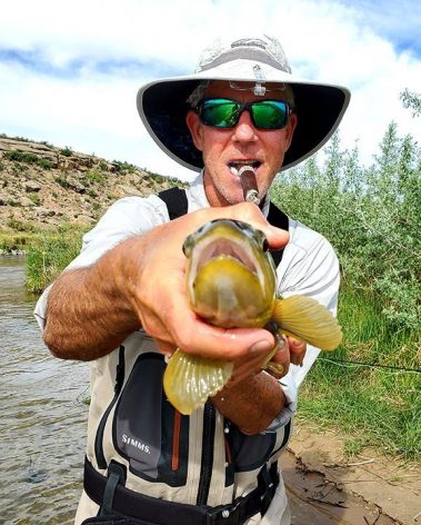 A Jeremy Allan Fly Fishing customer with a big brown trout