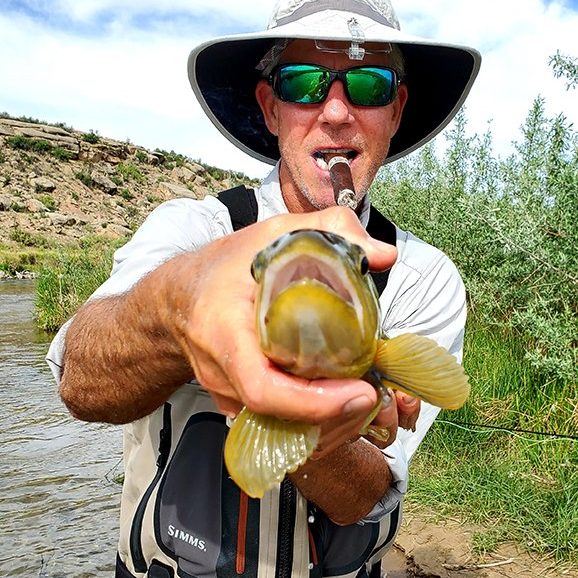 A Jeremy Allan Fly Fishing customer with a big brown trout