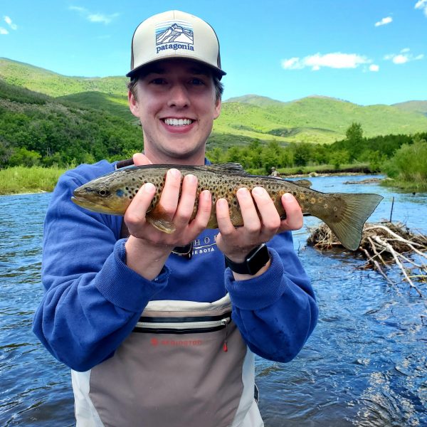 A Jeremy Allan Fly Fishing customer with a big brown trout