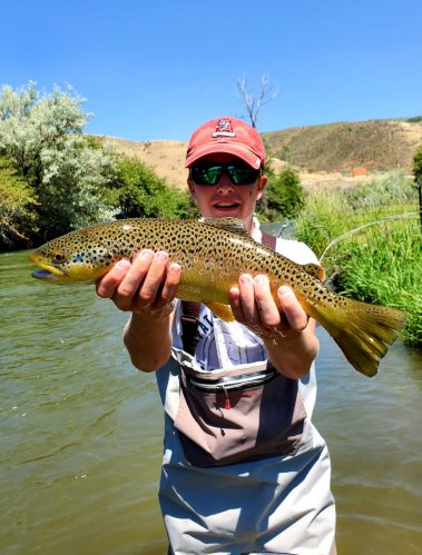 A Jeremy Allan Fly Fishing customer with a big brown trout