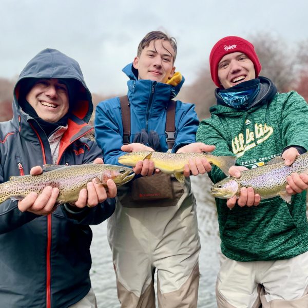 Three Jeremy Allan Fly Fishing clients all with trout caught at the same time on the Provo River