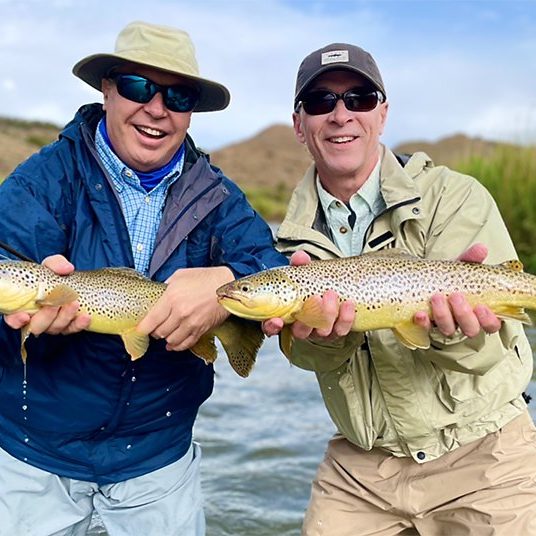 Jeremy Allan customers with two big brown trout