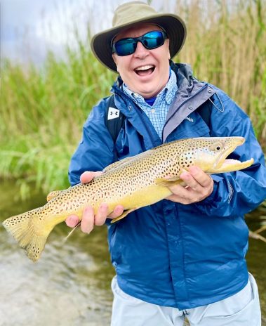 A Jeremy Allan Fly Fishing customer with a big brown trout