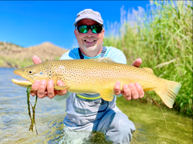 A Jeremy Allan Fly Fishing customer with a big brown trout