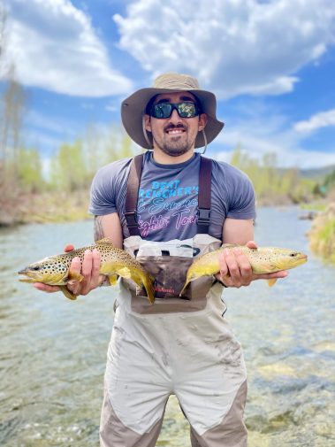A Jeremy Allan Fly Fishing customer with two big brown trout on the Provo River