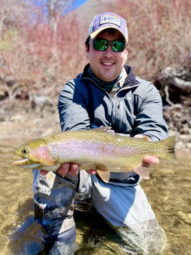 A Jeremy Allan Fly Fishing customer with a big rainbow trout on the Provo River