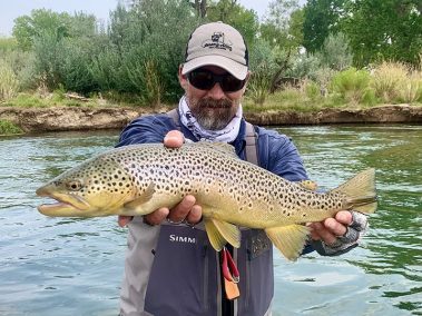 Jeremy Allan with a nice brown trout caught on a small stream in Utah