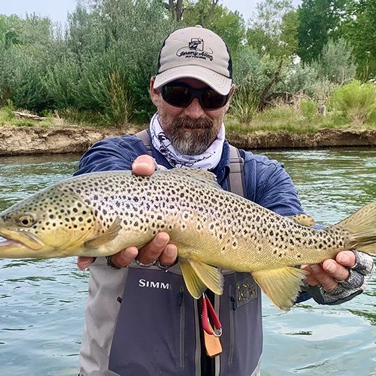 Jeremy Allan with a nice brown trout caught on a small stream in Utah