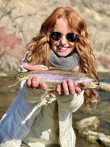 A Jeremy Allan Fly Fishing customer with a big rainbow trout on the Lower Provo River