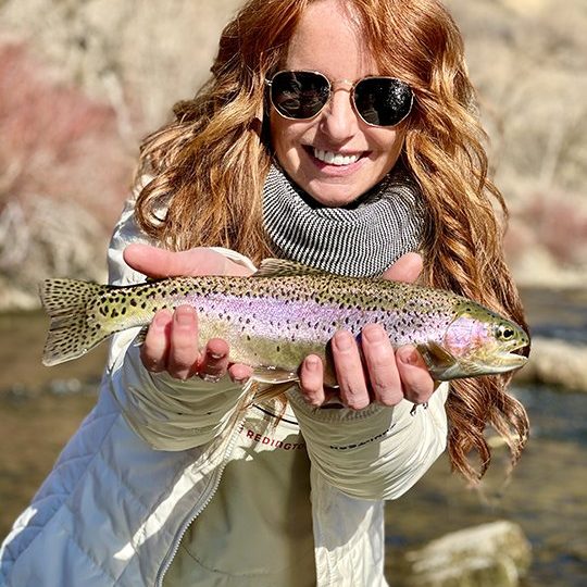 A Jeremy Allan Fly Fishing customer with a big rainbow trout on the Lower Provo River