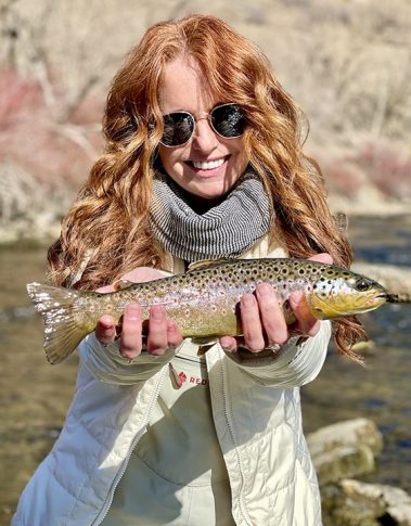 A Jeremy Allan Fly Fishing customer with a nice brown trout on the Lower Provo River