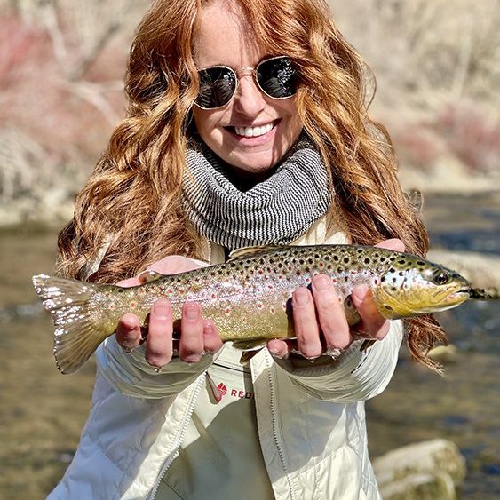 A Jeremy Allan Fly Fishing customer with a nice brown trout on the Lower Provo River