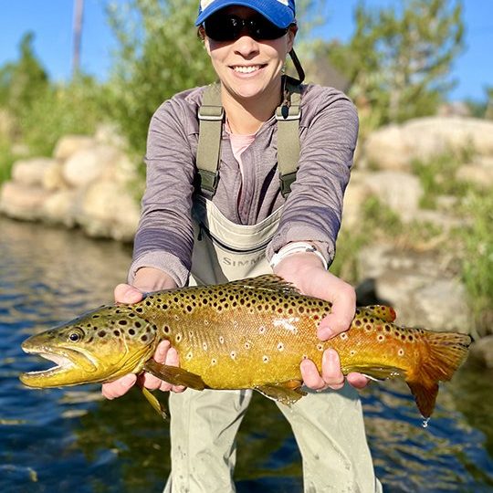 A Jeremy Allan Fly Fishing customer with a big brown trout