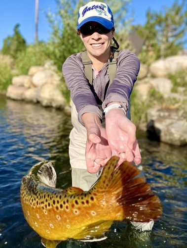 A Jeremy Allan Fly Fishing customer with a big brown trout
