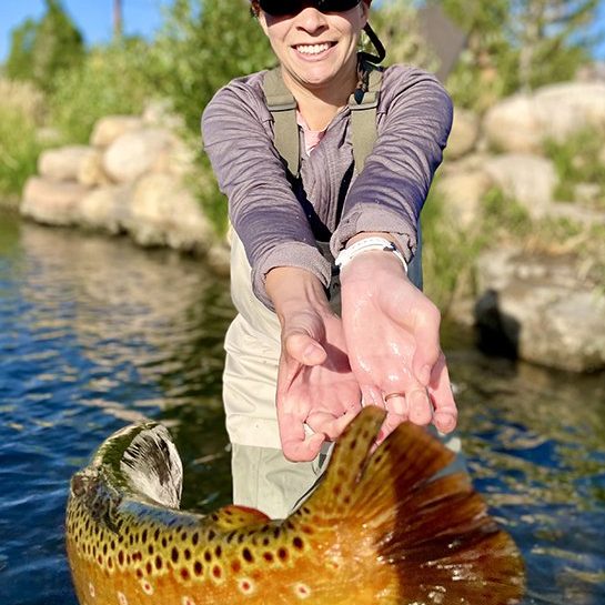 A Jeremy Allan Fly Fishing customer with a big brown trout