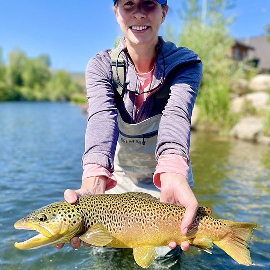A Jeremy Allan Fly Fishing customer with a big brown trout