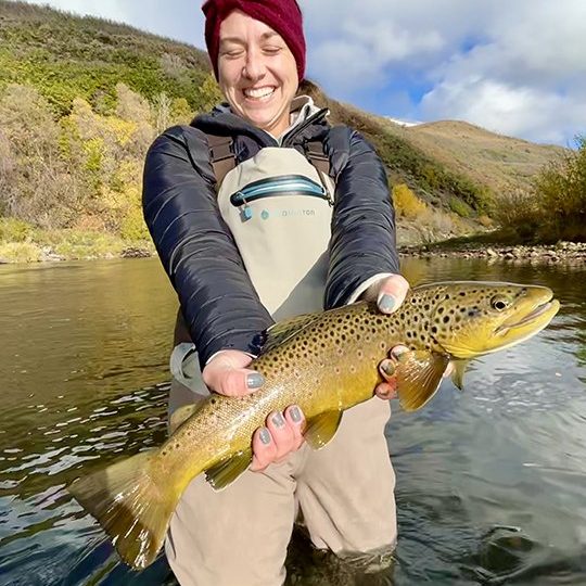 A Jeremy Allan Fly Fishing customer with a big brown trout