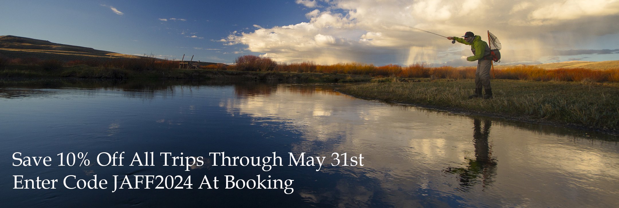 A fly fisherman casting on a river.