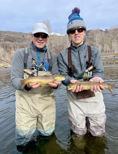 A father and son with two nice Provo River Brown Trout. Near Salt Lake City, Utah