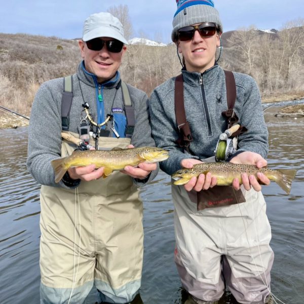 A father and son with two nice Provo River Brown Trout. Near Salt Lake City, Utah