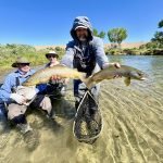 Owner and guide Jeremy Allan holding two big brown trout