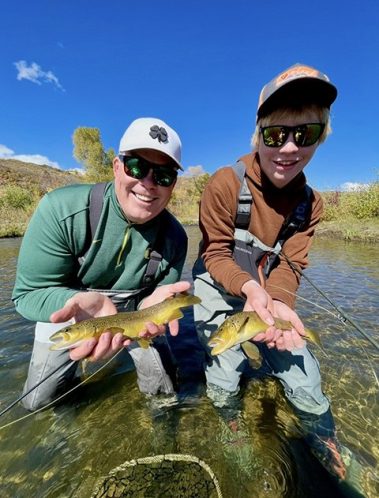 A father and son catching trout at the same time while on guided fly fishing trip with Jeremy Allan Fly Fishing