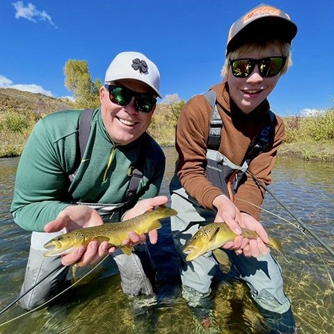 A father and son catching trout at the same time while on guided fly fishing trip with Jeremy Allan Fly Fishing